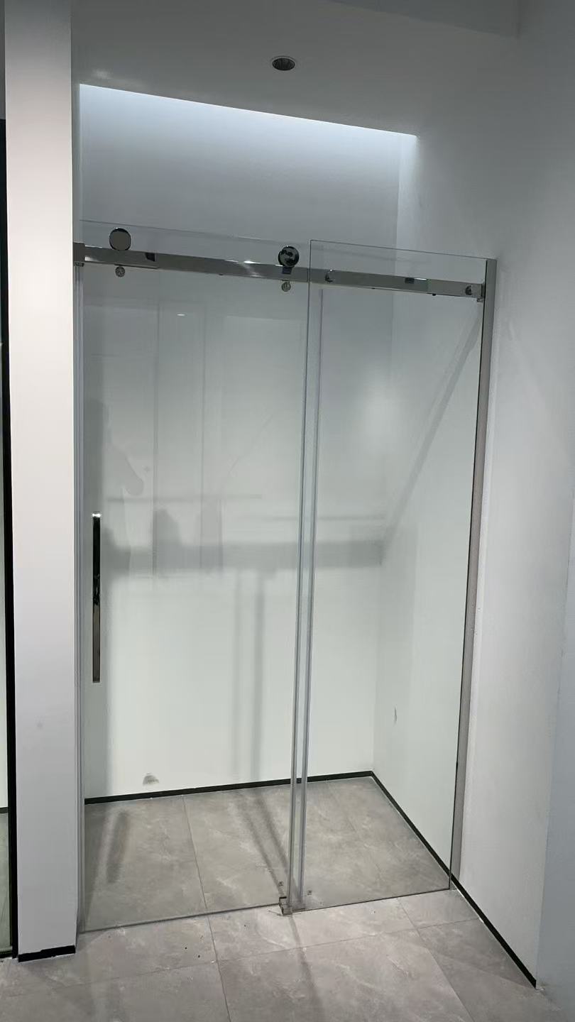 Frameless shower enclosure
